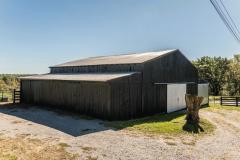 Solid 48x44 barn with a 16x48 & 12x28 equipment shed attached to either side. This well maintained barn houses all of the Farm Equipment currently used to maintain this property.