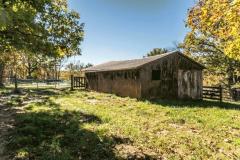 Implement shed in the center of the property overlooks the pond. Currently housing hay taken from this land, the shed is nice and dry.