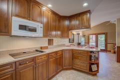 Beautiful updated kitchen w/cherry cabinets, quartz counters, double ovens, large walk-in pantry.