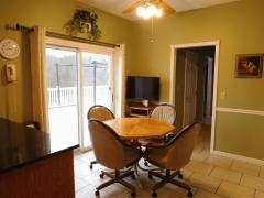 Eat-in kitchen with sliding door out to the large deck