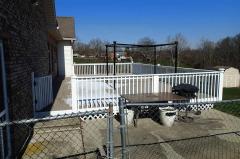 Large deck with fence around the yard