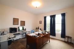Office is private area off the entry and has adjoining full bath.