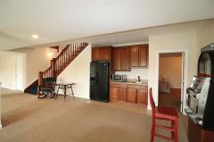 Wet bar area, pool table area, tv area,