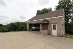 2 car garage with another area with just work room ... Loft over the 3 bays for storage