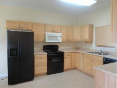 The kitchen offers a large working and storage area.