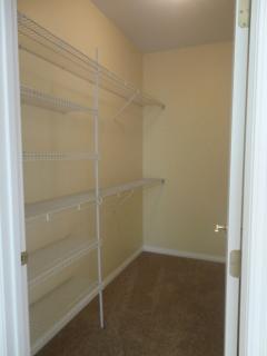 Nice walk in closet with plenty of storage area.