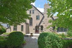Gracious Tudor on beautiful tree lined street in quiet Park Hills!