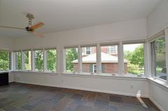 Sun porch with natural stone floor.