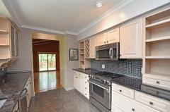 Updated kitchen with high end appliances and beautiful raw edge granite.