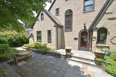 Your entrance to the home is a slate courtyard, notice the original leaded windows as you enter.