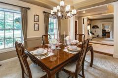 Dining room is a show stopper as well with a stunning chandelier, tray ceiling, thick crown molding surrounds the room. Entertain in style!