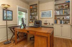 This executive office boasts massive built ins, impressive crown molding and hardwood floors throughout. The materials used in this home scream SUCCESS! Solid wood crown molding...NO MDF here! Call today for a showing!