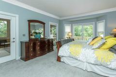 The master has direct access to the screened in porch. The bay window is just the right frame to the private back yard.
