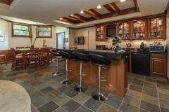 Mahogany bar with mahogany details throughout. Slate flooring, turret for a dining area, walkout to the patio, plenty of room for many friends and family to stretch out.
