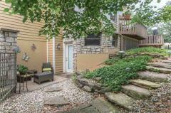 Step outside the basement for a breath of fresh air. Gorgeous hardscape stairs step up the the amazing backyard.