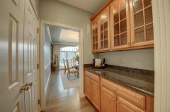 Under cabinet lighting, wood floors and and recessed lighting finish off this perfect kitchen.