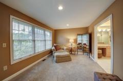 Two story breakfast room with hardwood floors and a beautiful view for that morning bite.