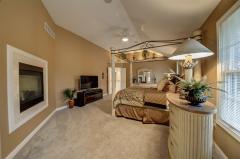 Enjoy family meals in the dining room offering wood floors with carpet inlay, trey ceiling with chandelier, crown molding and a Butler's Pantry.