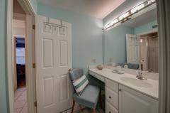 See thru gas fireplace, ceramic tile, jetted tub, double vanity, tiled shower with bench seating and oil bronzed fixtures. Customized closet with built-in drawers, shelves and cabinets.