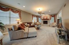 Plenty of space for working at home when needed. Large window provides plenty of natural lighting. Wood floors, crown molding and french doors finish off the distinguished look of this room.