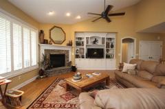 Spacious Island Kitchen with Custom Cabinetry, Hardwood Floors, Stainless Steel Appliances and Granite Counter Tops