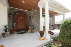 Hardwood Floors, Custom Bookcases, and Stacked Stone Fireplace are all accentuated by the Soaring Ceilings